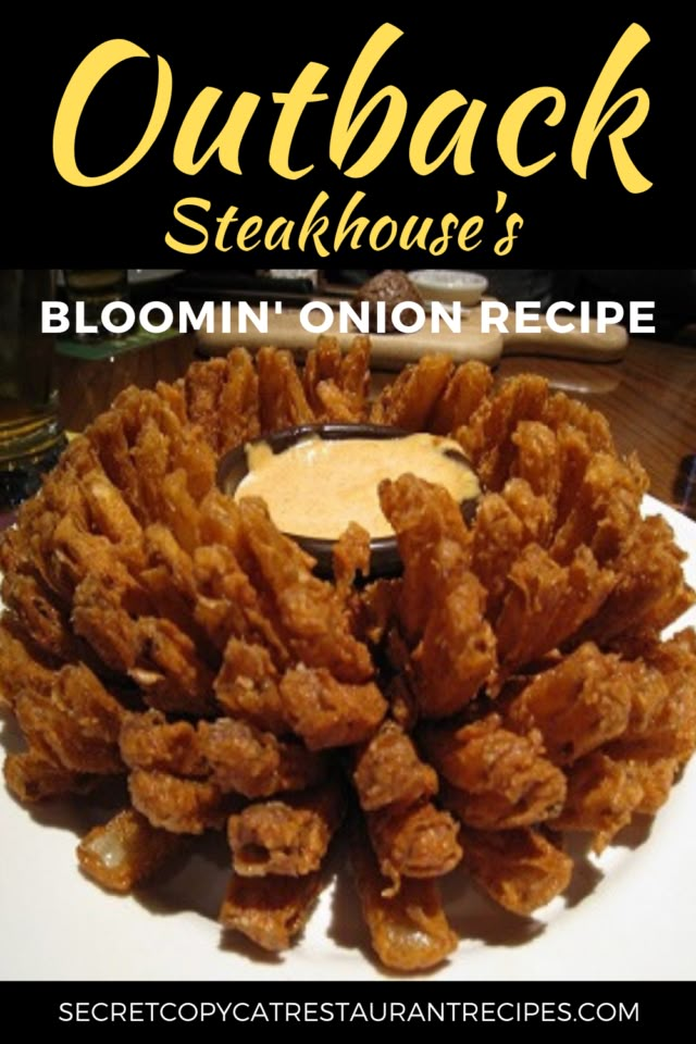 a white plate topped with fried onion rings