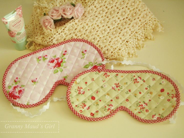 three pieces of cloth with flowers and lace on them sitting next to a crochet bag