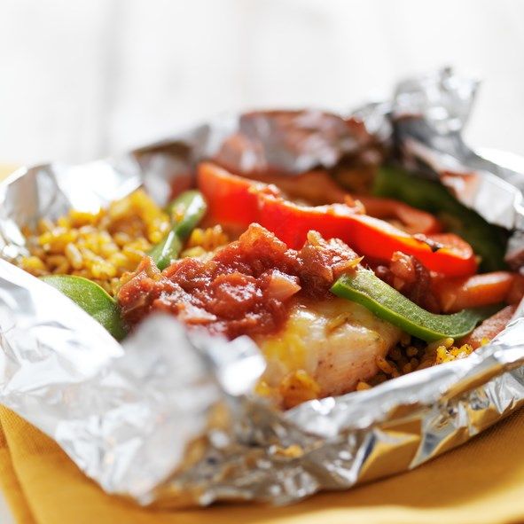 the food is prepared and ready to be eaten in the foil wrapper on the table