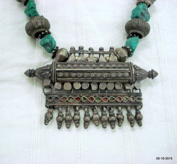 vintage antique tribal old silver necklace from rajasthan india. great handmade design made of solid silver and turquoise beads. nice piece good for jewelry collection.length - 61 cm(24") we can adjust the length.pendant size - 5.5/8.3 cm(2.16/3.26")weight - 116 gramsmaterail - silver & original old worn piece. Traditional Turquoise Necklace For Festivals, Traditional Turquoise Necklace For Festivals With Silver Accents, Handmade Silver Turquoise Necklace For Festivals, Bohemian Silver Turquoise Necklace For Festivals, Traditional Turquoise Necklace With Patina, Traditional Silver Turquoise Necklace For Festivals, Traditional Turquoise Necklace With Silver Beads, Silver Bohemian Turquoise Necklace For Festivals, White Gold Amulet Necklace With Oxidized Finish