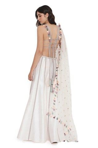 Off white and ivory sleeveless halter neck choli with all over petal bloom embroidery. Paired with a kalidar sharara. - Aza Fashions Festive White Sleeveless Choli, Festive Sleeveless White Choli, White Anarkali Style Sleeveless Sharara, White Sleeveless Sharara For Festive Occasion, Sleeveless White Lehenga For Festivals, White Sleeveless Unstitched Choli, White Sleeveless Festive Sharara, Traditional Wedding Dress With Back Tassel Tie-up, Fitted Sleeveless White Sharara