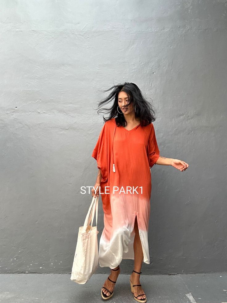 Flowy V-neck Kaftan For Day Out, Orange V-neck Summer Beach Dress, Bohemian V-neck Maxi Dress With Side Slits, Orange V-neck Maxi Dress For Beach, Summer V-neck Kaftan For Beach Season, Flowy V-neck Summer Kaftan, Chic Long Summer Kaftan, Chic Free Size Beach Kaftan, Chic Free Size Kaftan For Beach