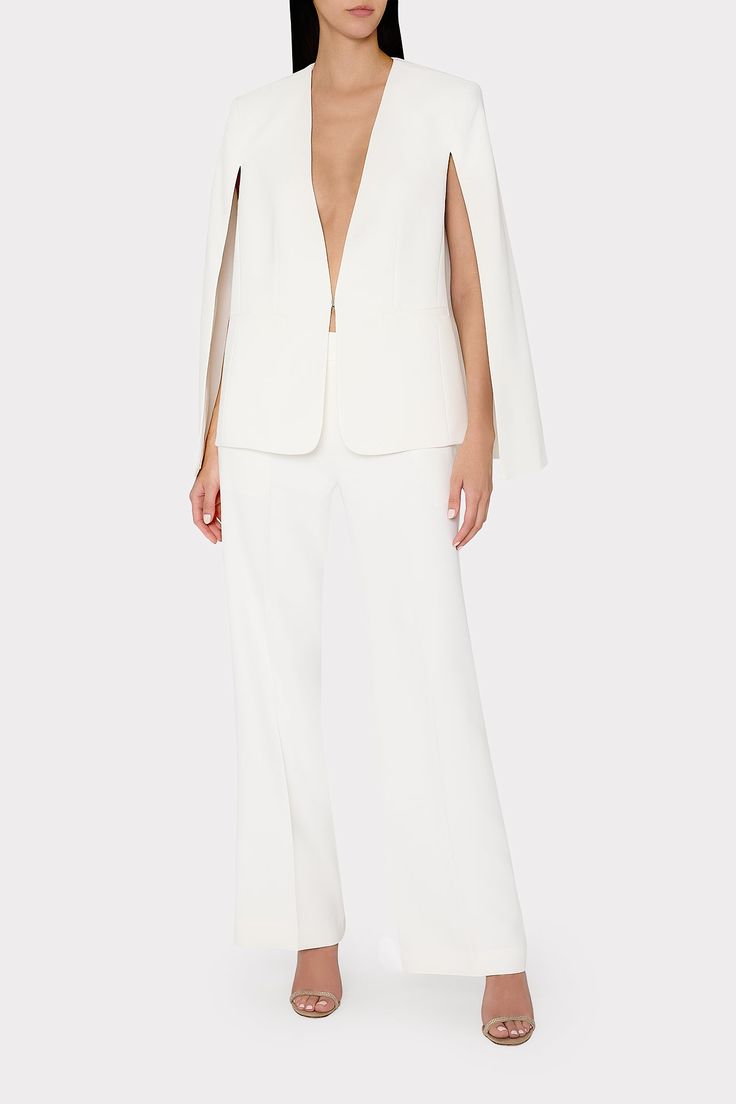 Elegant V-neck Outerwear With Hidden Button Closure, Party Blazer With Structured Shoulders And Notch Lapel, Modern Evening Blazer, Elegant V-neck Party Outerwear, Elegant Structured Pantsuit For Party, Elegant Tailored V-neck Blazer, Tailored V-neck Elegant Blazer, Sleek Evening Pantsuit With Notch Lapel, Sleek Notch Lapel Evening Pantsuit