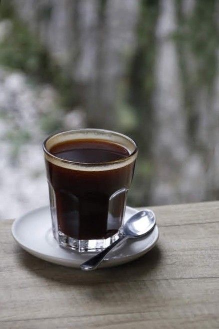 a cup of coffee sitting on top of a saucer