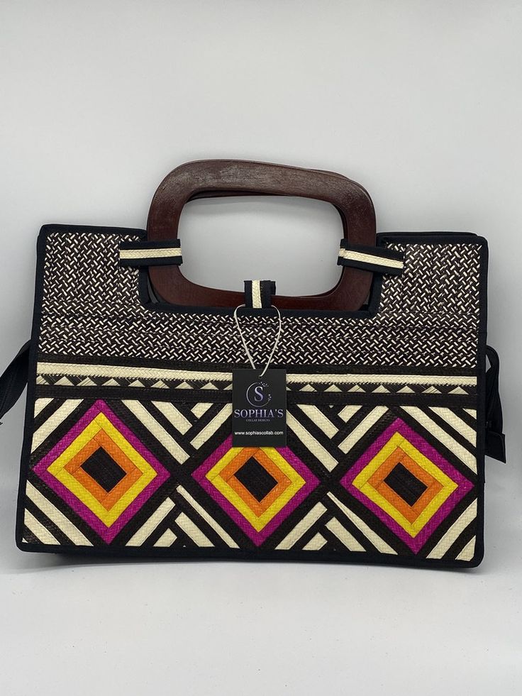 These beautiful handbags are made from Cana Flecha which is an indigenous palm fiber found in the northern territory of Colombia. They are beautifully hand crafted by the people from the Zenu tribes in Colombia. These handbags are colorful with vibrant colors, which is a pure reflection on the region and the warmness of these master artisans that work in this industry every day. Traditional Black Rectangular Bag, Traditional Rectangular Vacation Bag, Traditional Rectangular Vacation Bags, Traditional Satchel Bag For Beach, Traditional Top Handle Straw Bag, Traditional Satchel Beach Bag, Traditional Black Rectangular Crochet Bag, Traditional Natural Color Top Handle Bag, Traditional Natural Color Top Handle Shoulder Bag