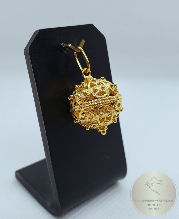 "This is largest size of our filigree ball pendants in 14k gold ★ Traditional Croatian filigree pendant, handcrafted in solid 14 k gold. Versatile to wear with any outfit, and perfect for any occasion. Elongated chain bail makes it suitable to combine with most styles of gold chains or leather cords. Replica of the 19th century ethnic, heritage Croatian jewelry from Dubrovnik - Dalmatia region.★ *Handmade on order in 7-10 business days * Due to the handmade creation, every piece is unique, so th Ornate 22k Gold Pendant Jewelry, Traditional 14k Gold Necklace With Intricate Design, Traditional Pierced 14k Gold Jewelry, Traditional 14k Gold Pierced Jewelry, Gold Pendant Jewelry With Pierced Details, Intricate 14k Gold Jewelry As Gift, Byzantine Pendant Necklace For Formal Occasions, 14k Gold Jewelry With Intricate Design For Gift, 14k Gold Jewelry With Intricate Design As Gift