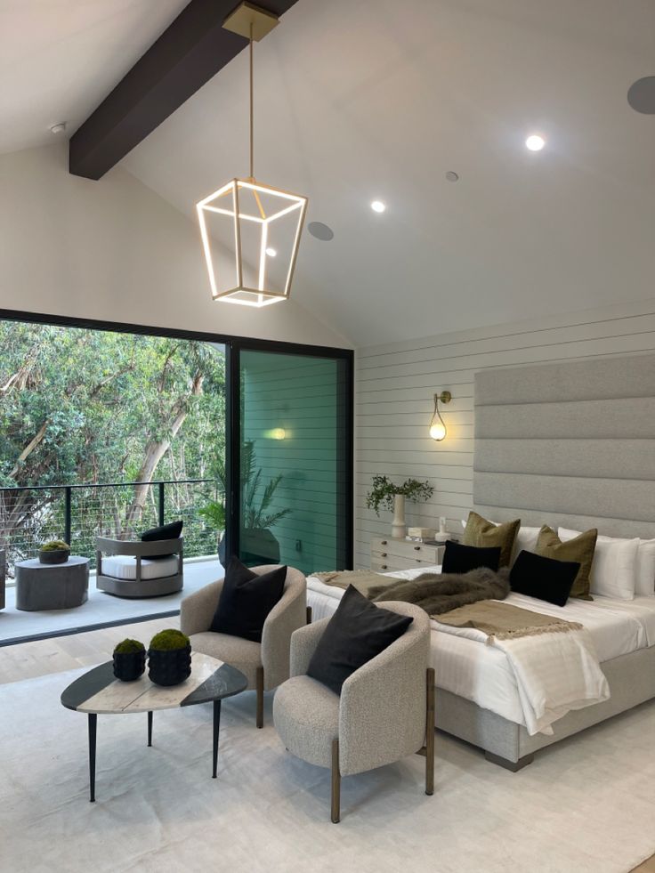 a modern bedroom with white walls and flooring