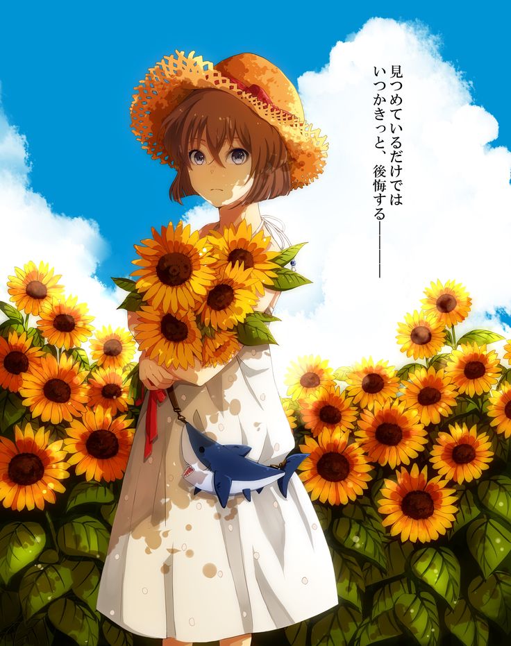 a woman in a sunflower field holding flowers