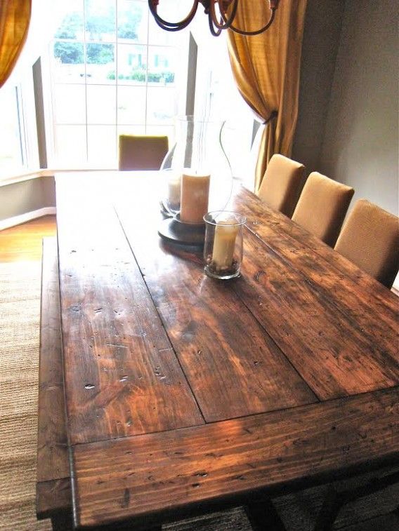 a dining room table with candles on it