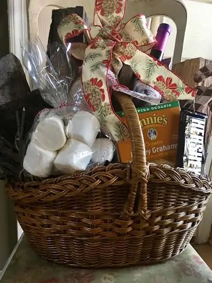 a wicker basket filled with toiletries and other items sitting on a chair next to a window