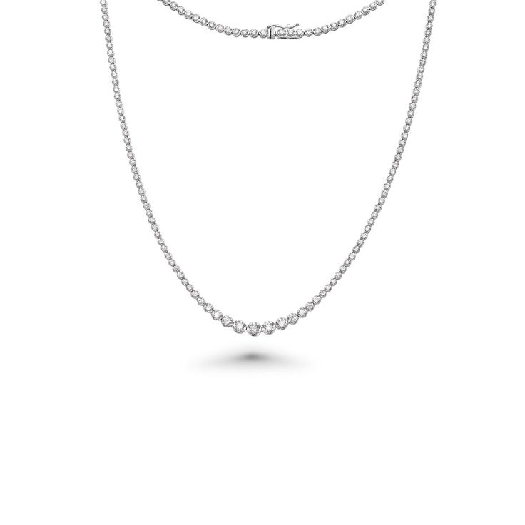 The Riviera Diamond Tennis Necklace is an exquisite piece of jewelry that combines elegance and timeless beauty. This necklace features a total carat weight of 4.00 ct., showcasing a dazzling array of diamonds. The diamonds used in this necklace range in size from 2.60 mm to 4.60 mm, creating a captivating visual effect with their varying sizes. The necklace is crafted with meticulous attention to detail and is set in a Buttercup Setting, which is known for its graceful and secure design. The Bu Classic Round Single Strand Diamond Necklace, Classic Single Strand Round Diamond Necklace, Elegant Single Strand Round Tennis Necklace, Elegant Single Strand Tennis Necklace, Classic Single Strand Diamond Necklace, Classic Platinum Tennis Necklace With Brilliant Cut, Classic Single Strand Diamond White Jewelry, Fine Jewelry Single Strand Diamond Necklace, Classic Single Strand Cubic Zirconia Diamond Necklace