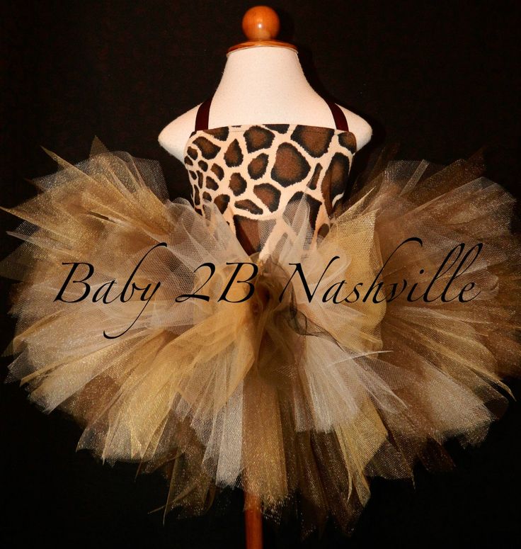 a baby giraffe tutule dress on a mannequin