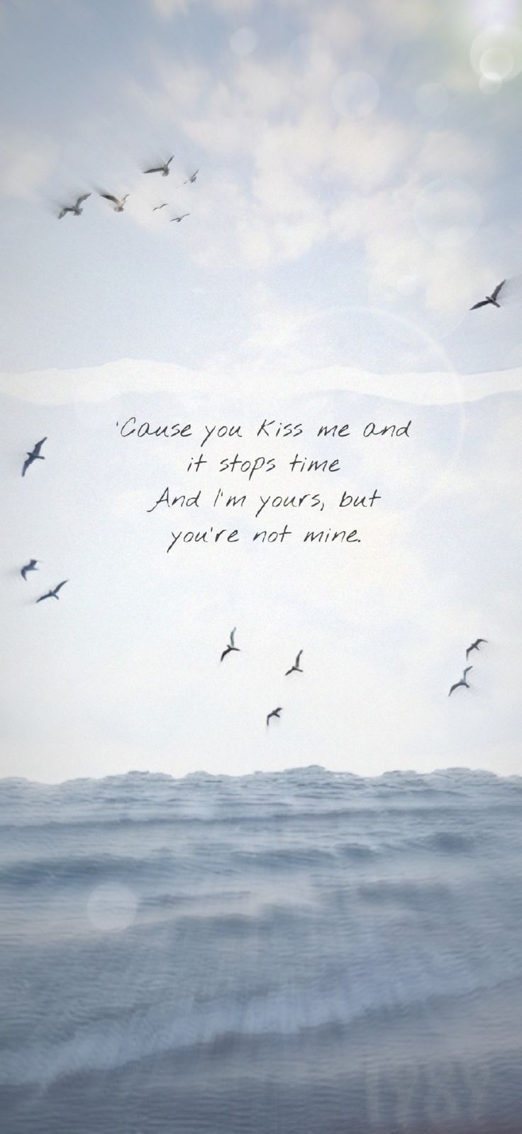 birds flying in the sky over water with a quote written on it's side