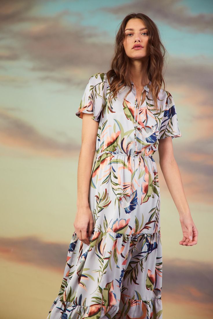 A tropical print makes this maxi dress irresistible. Framed by swingy short sleeves, it's got a sweetly tied neckline, cinching at the waist, and a long, tiered skirt that moves beautifully. A little piece of paradise for your wardrobe. •Split neckline with self-tie •Short sleeves •Elasticized waist •Tiered styling Ite Vacation Dresses Casual, Wedding Guest Dress Trends, I Like Pretty Things, Long Tiered Skirt, Spring Maxi Dress, Casual Wedding Dress, Vacation Dresses, Silver Dress, Tier Skirt