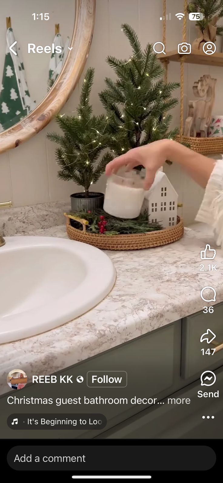 someone is pouring water into a cup on the counter in front of a christmas tree