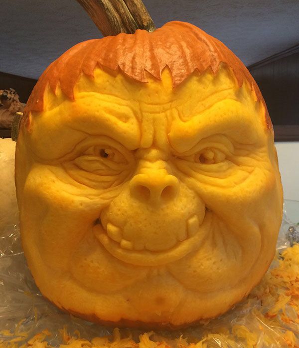 a carved pumpkin with an evil face on it