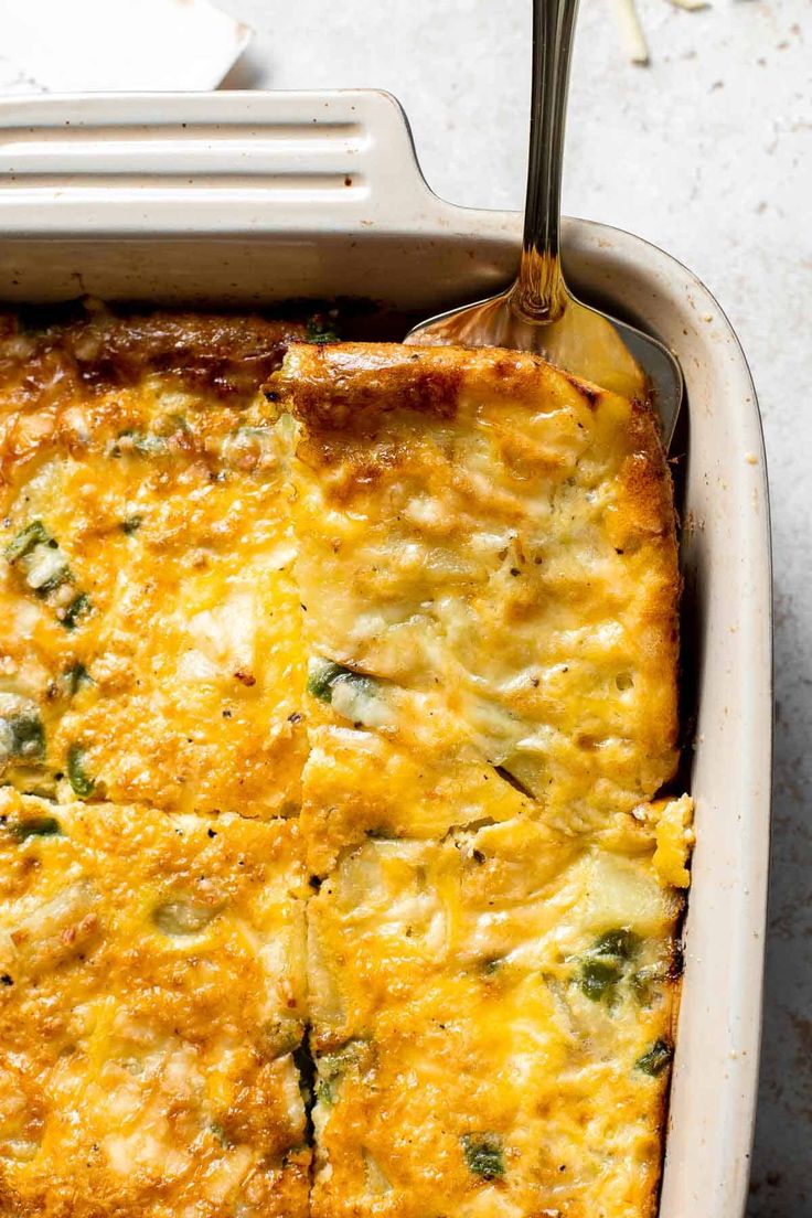 a casserole dish with broccoli and cheese