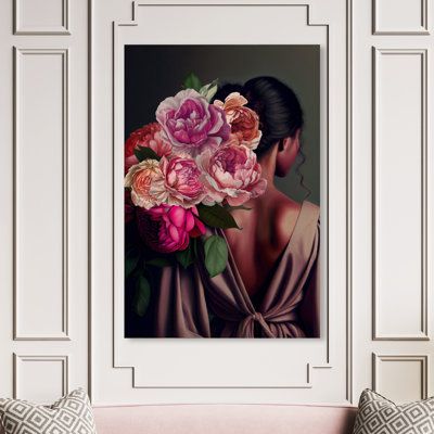 a woman with flowers in her hair is sitting on a pink couch next to a white wall