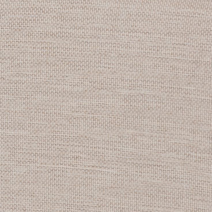 a close up view of the textured fabric on a piece of cloth that is beige