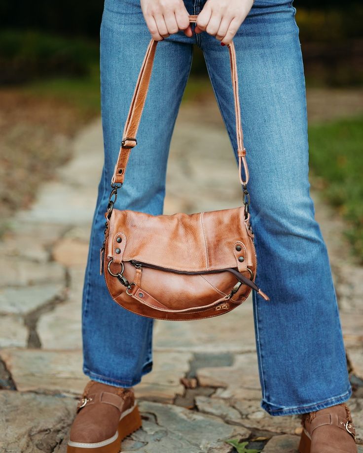 A Customer favorite, this cross body bag has plenty of style. TAHITI features a zippered fold top with internal slip pockets on the inside. The zippered outside pocket is perfect for your cell or keys. This beautiful bag will soon be your favorite accessory.Chrome free, vegetable tanned leatherFold over design with top zipper closureLined interior with slip pockets8 in. H, 12 in. W, 1.5 in. D, with 22 in. DropMade in Mexico Brown Crossbody Saddle Bag With Zipper, Daily Use Saddle Shoulder Bag With Zipper Pocket, Brown Saddle Bag With Zipper For Everyday Use, Brown Saddle Bag With Zipper Closure For Everyday, Everyday Clutch Shoulder Bag With Zipper, Daily Use Saddle Shoulder Bag With Zipper, Daily Use Saddle Shoulder Bag With Zipper Closure, Daily Use Crossbody Hobo Bag With Zipper Pocket, Everyday Saddle Shoulder Bag With Zipper Closure