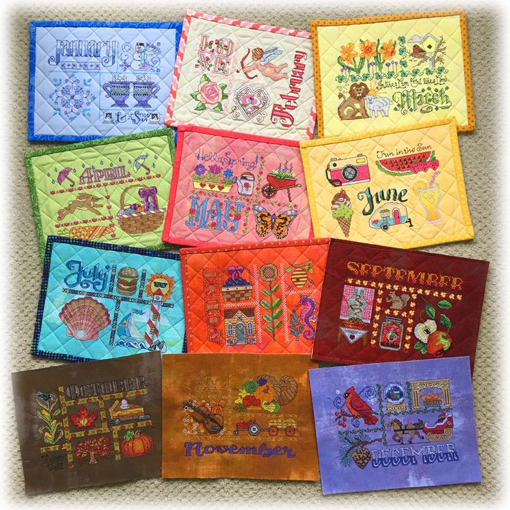 a group of nine hand embroidered napkins with different designs on them, all in bright colors