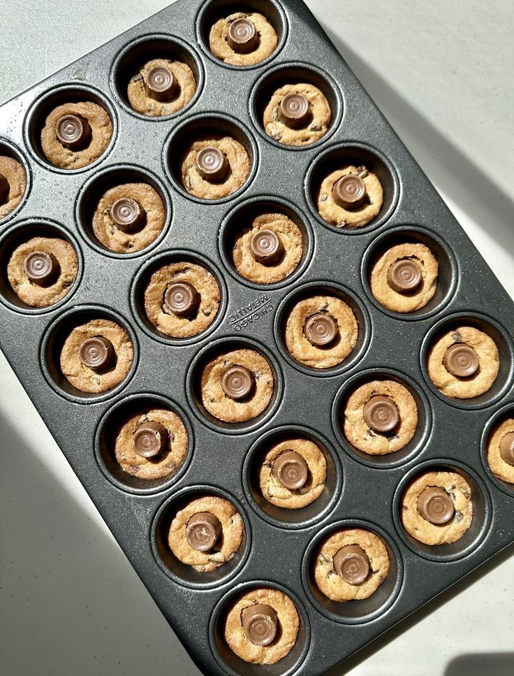 a muffin pan filled with peanut butter cupcakes