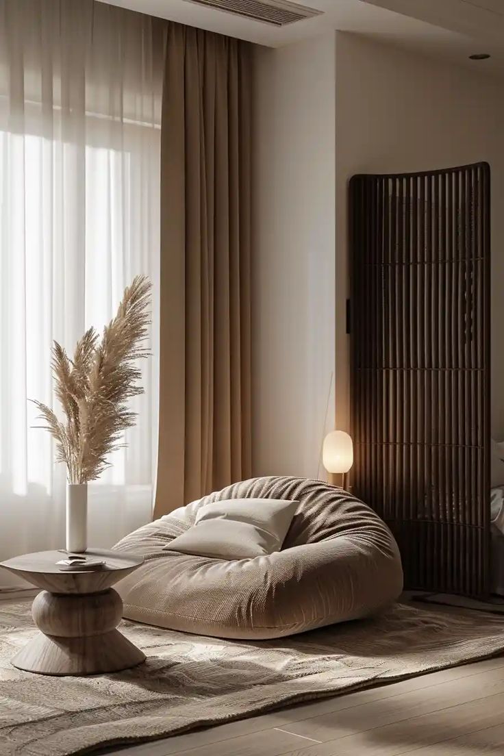 a living room filled with furniture and a plant in a vase on top of a table