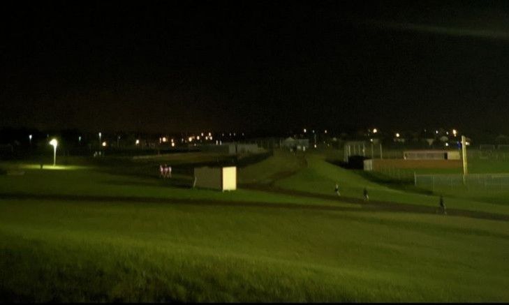 a night time view of a green golf course