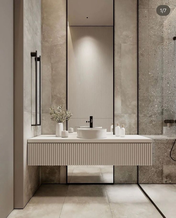 a modern bathroom with two sinks and mirrors