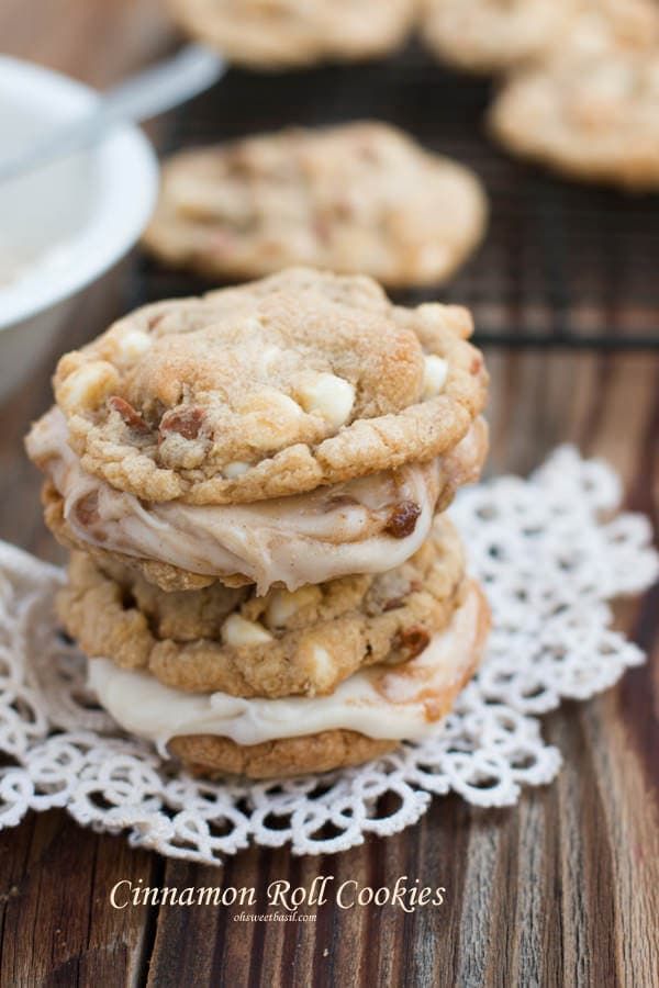 three cookies stacked on top of each other next to a bowl of icecream