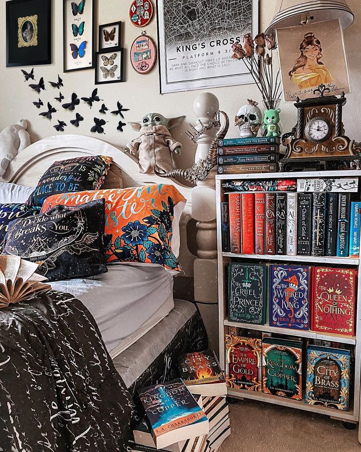 a bed room with a neatly made bed and lots of books