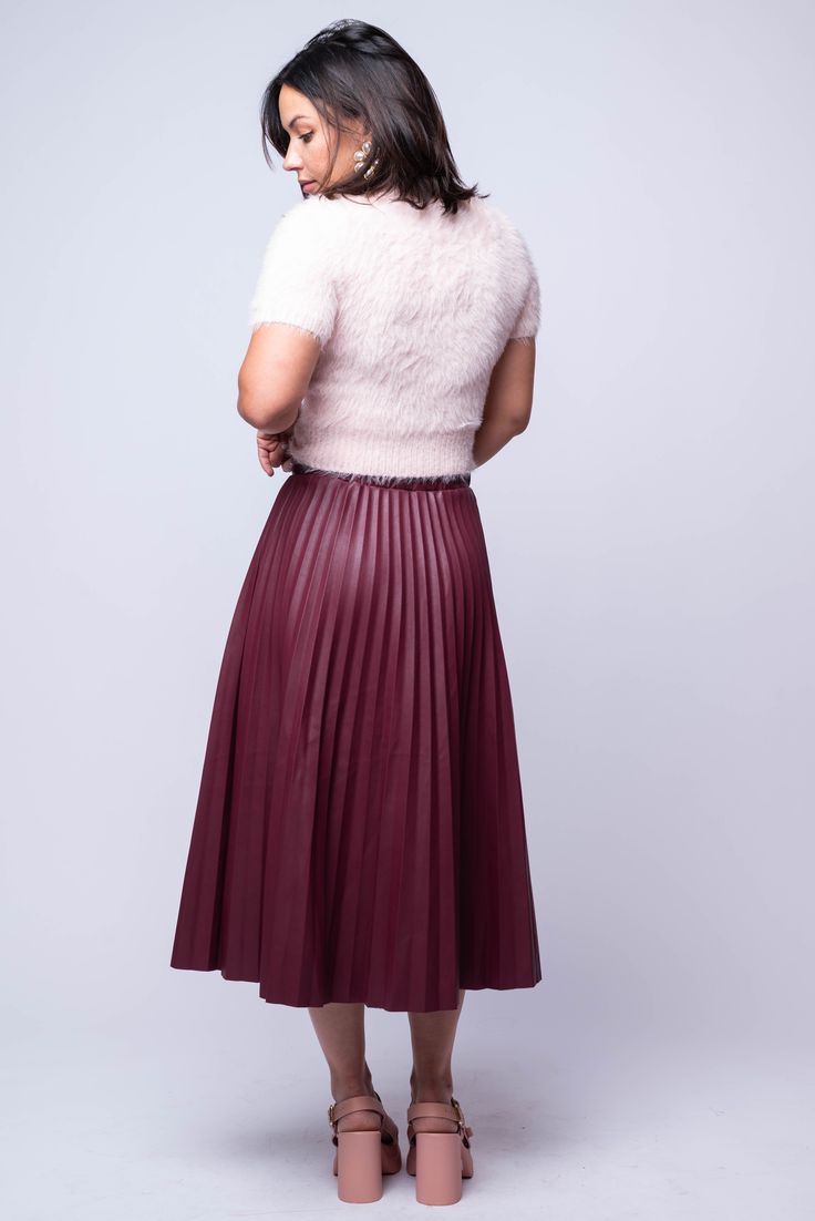 The Pelia Pleated Midi is a must-have for any wardrobe. This midi skirt features delicate pleating, an elastic back panel for a comfortable fit, and is made from luxurious burgundy vegan leather. Its A-line design flatters any figure and adds a touch of sophistication to any outfit. Hand Wash Cold Import 55% PU | 45% Viscose Fit Guide: Tabatha is 5ft 3 inches; Bust 34”, Waist 24”, Hips 36” Model is wearing a size small True to size *available at our Bandit location Chic Red Pleated Skirt For Workwear, Elegant Burgundy Pleated Skirt, Chic Burgundy Skirt For Spring, Chic Burgundy Midi Skirt, Elegant Burgundy Skirt For Spring, Chic Burgundy Skirt For Work, Fall Burgundy Pleated Skirt, Fall Season Burgundy Pleated Skirt, Chic Burgundy Skirt