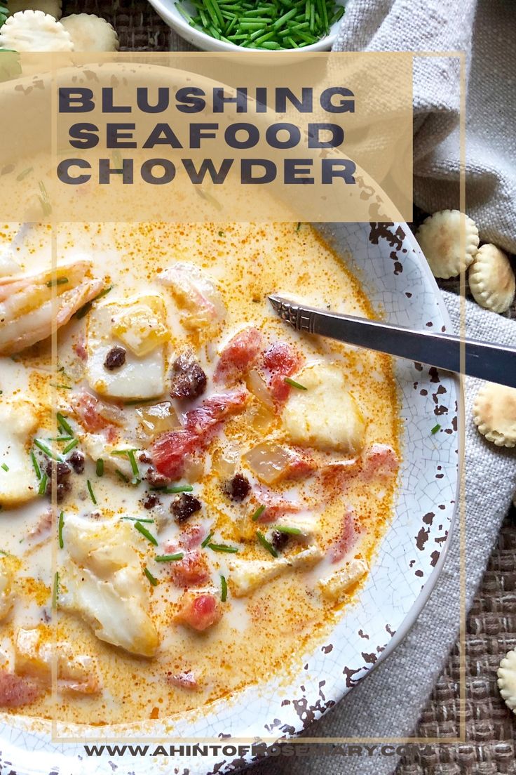 a white bowl filled with seafood chowder on top of a table