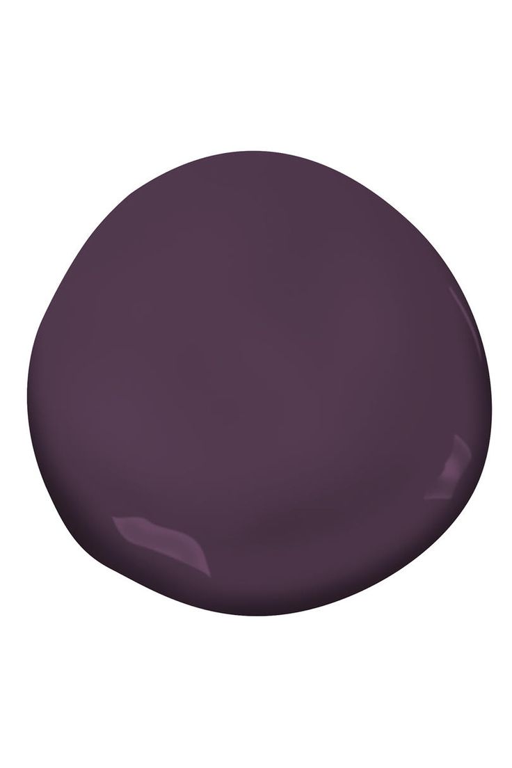 a close up of a purple color on a white background