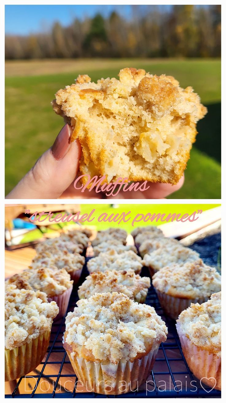 some muffins are cooling on a rack and one is being held up by someone's hand