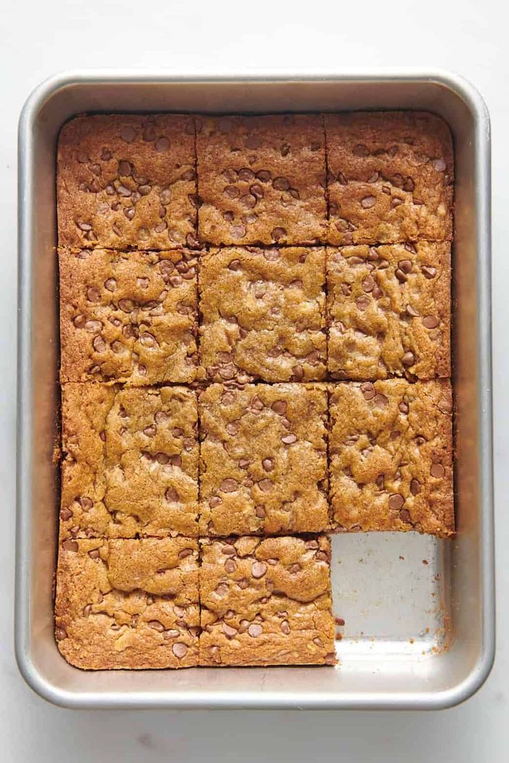 a square pan filled with brownies on top of a table