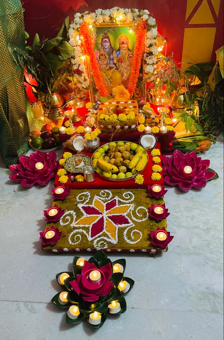 an arrangement of food and candles on a table