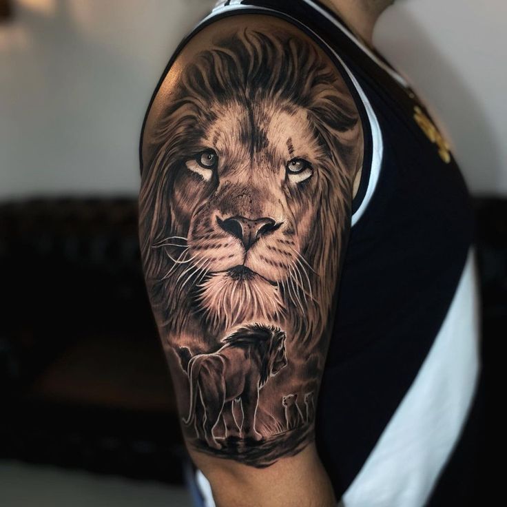 a man with a lion tattoo on his arm