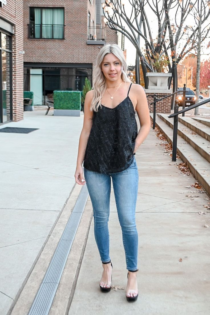 Our Textured tank top features sparkly and black detail on the front with adjustable straps! So cute to wear this holiday season! 100% Polyester Model is wearing a Small True to size! *For more info on model measurements checkout our model sizes page!* MADE BY: KORI Black Cami Top For Fall, Casual Tank Strap Tops For Night Out, Trendy Fall Cami Tank Top, Casual Tops With Tank Straps For Night Out, Casual Tank Straps Camisole For Night Out, Trendy Tank Top For Night Out In Fall, Trendy Cami Tank Top For Night Out, Fall Black Cami Top, Casual Tank Top With Tank Straps For Party