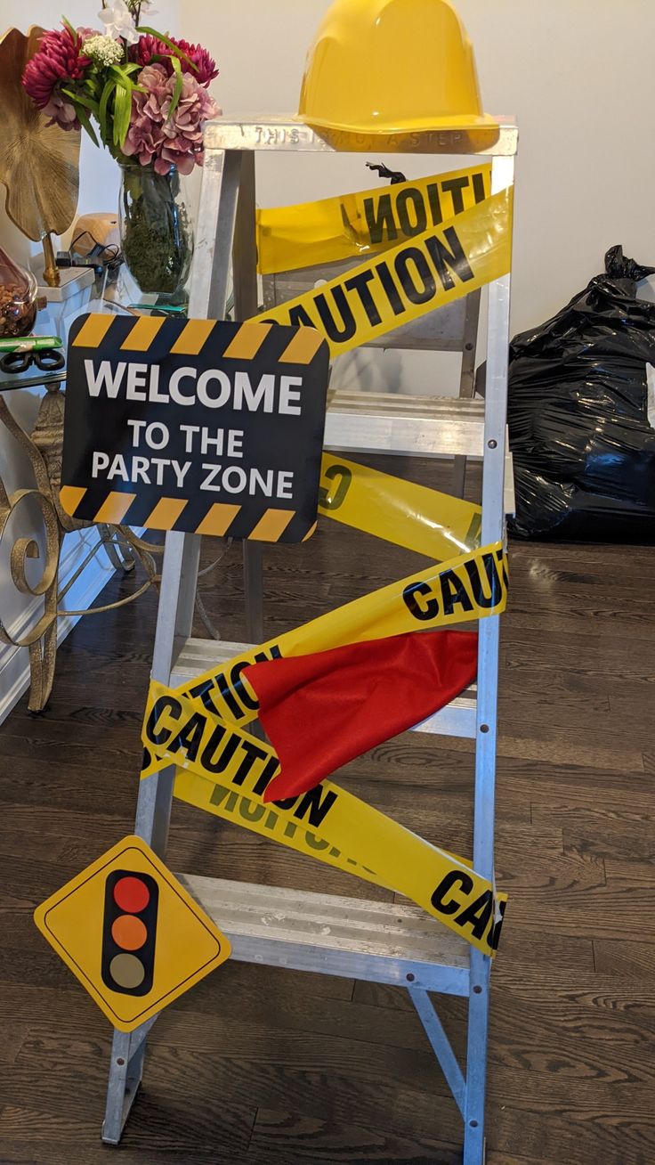 there is a sign that says welcome to the party one and caution signs in front of it