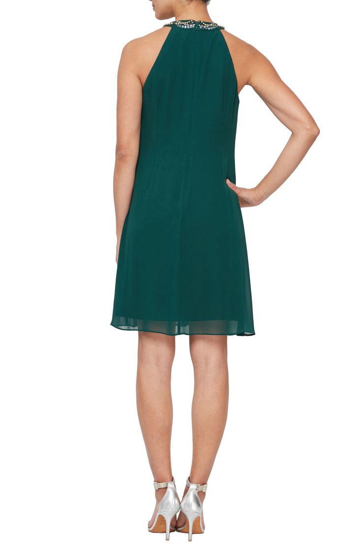 Elegant neckline beading adds glamour to this chic chiffon dress. 36" length (size 6P) Bead braided halter neck Sleeveless Back zip closure 100% polyester Hand wash cold separately Imported Model stats: 5'10" height, 32" bust, 25" waist, 36" hip. Model is wearing size 6P. Green Embellished Chiffon Dress, Elegant Sleeveless Chiffon Georgette Dress, Elegant Sleeveless Chiffon Dress, Elegant Sleeveless Georgette Dress, Elegant Flowy V-neck Halter Dress, Flowy Chiffon Sleeveless Dress, Dressy Chiffon Cocktail Dress, Summer Chiffon Dress Embellished, Summer Formal Dress With Beaded Straps