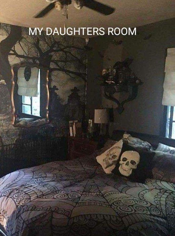 a bedroom decorated in black and white with skulls on the bed, two windows, and a ceiling fan