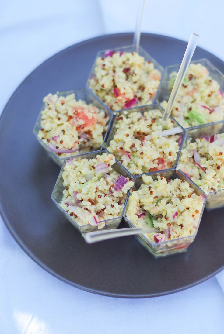 there are many food items on the plate and one is cut into cubes with chopsticks