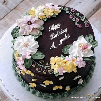 a birthday cake decorated with flowers on top of a white plate and an image of a man's face