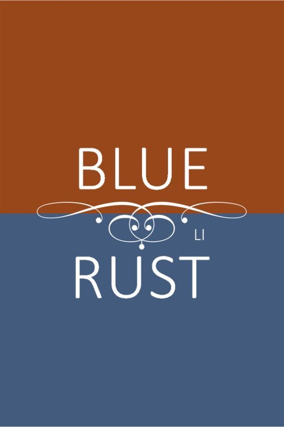 the blue rust logo on an orange and brown background with white lettering that reads,'blue rust '