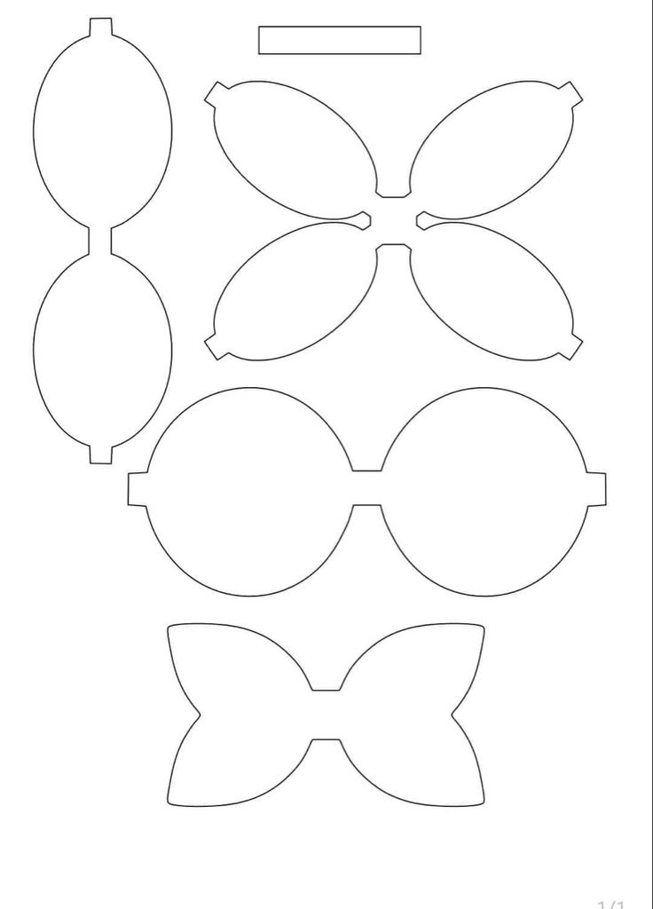 the paper cut out for an ornament with bows and leaves on it's sides