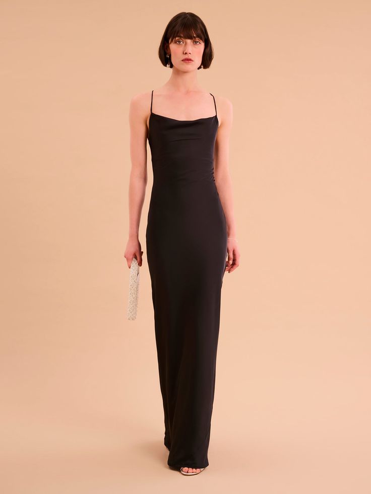 Ginny is an update on our classic Riviera in a gorgeous new maxi-length. She's got the same cowl neck and backless lace-up detail and is crafted from our signature slinky satin made using 100% recycled polyester. In a sultry black shade, Ginny is the perfect dress for when you feel like keeping it paired-back but chic. Velvet Collection, Black Shade, Denim Coat, Shirt Skirt, Shades Of Black, British Indian, Holiday Dresses, Cowl Neck, Perfect Dress