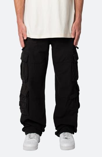 The relaxed fit of these all-cotton pants lets you move with ease all day long, while the multitude of cargo pockets keep all your essentials close at hand. 32" inseam; 9 1/2" leg opening; 11 3/4" front rise Zip fly with button closure; drawstring waist Front slant pockets; front zip pockets; cargo flap-patch pockets; back patch pockets 100% cotton Machine wash, tumble dry Imported Urban Cotton Cargo Pants For Outdoor, Combat Cotton Pants With Cargo Pockets, Black Urban Cargo Pants With Functional Pockets, Urban Style Cotton Cargo Pants For Outdoor, Urban Cotton Cargo Pants For Outdoor Activities, Black Cotton Cargo Jeans With Functional Pockets, Combat Cotton Bottoms With Multiple Pockets, Cotton Combat Bottoms With Multiple Pockets, Cotton Combat Cargo Jeans With Straight Leg