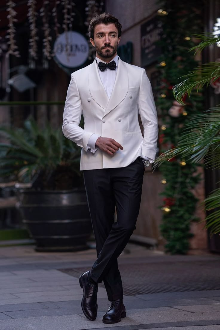 Radiate pristine sophistication in the White Double-Breasted Tuxedo 2-Piece by VIOSSI, featuring a classic double-breasted design tailored for timeless elegance in a striking, immaculate white hue. #whitetuxedo #doublebreastedtuxedo #VIOSSI #mensfashion #timelesselegance #sophisticatedlook #tuxedostyle #classicwhite Double Breasted White Suit, White Coat Black Pants Men, Mens White Suit Wedding, Off White Double Breasted Suit, Tuxedo For Men White, Mens White Tuxedo, Mens White Suit, Double Breasted Suit Men, Designer Tuxedo