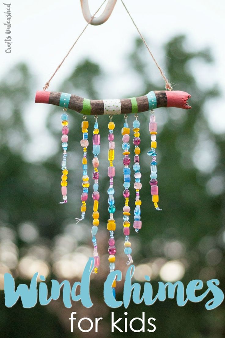 a wind chime hanging from a tree with the words wind chimes for kids